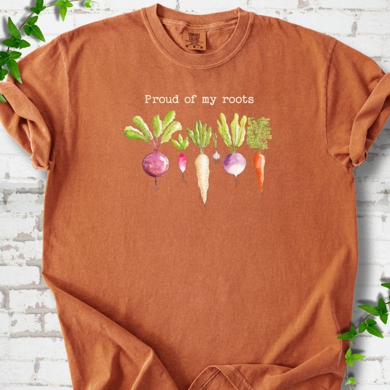 Yam Comfort Colors® T-shirt shown flat with "Proud of My Roots" text above watercolor-style root vegetables