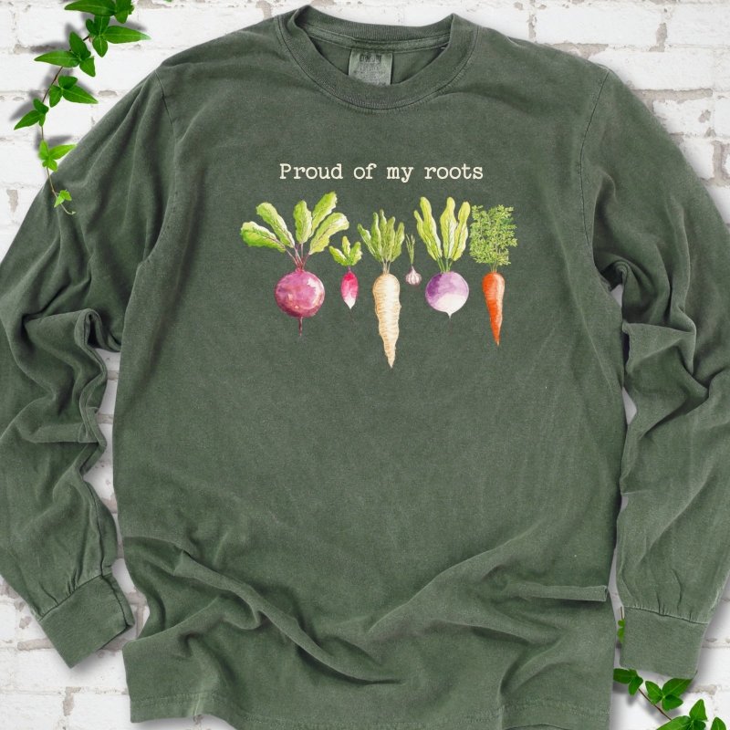 Hemp Comfort Colors® long sleeve T-shirt shown flat with "Proud of My Roots" text above watercolor-style root vegetables