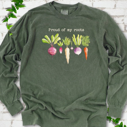 Hemp Comfort Colors® long sleeve T-shirt shown flat with "Proud of My Roots" text above watercolor-style root vegetables
