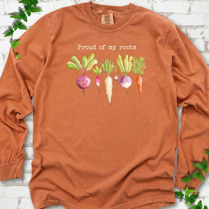 Yam Comfort Colors® long sleeve T-shirt shown flat with "Proud of My Roots" text above watercolor-style root vegetables