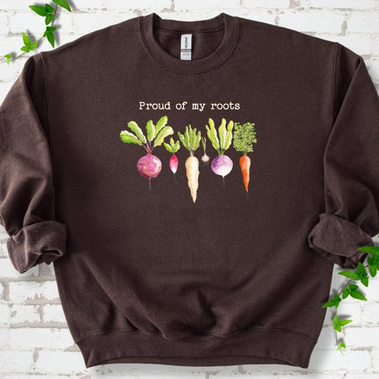 Dark Chocolate classic sweatshirt shown flat with "Proud of My Roots" text above watercolor-style root vegetables
