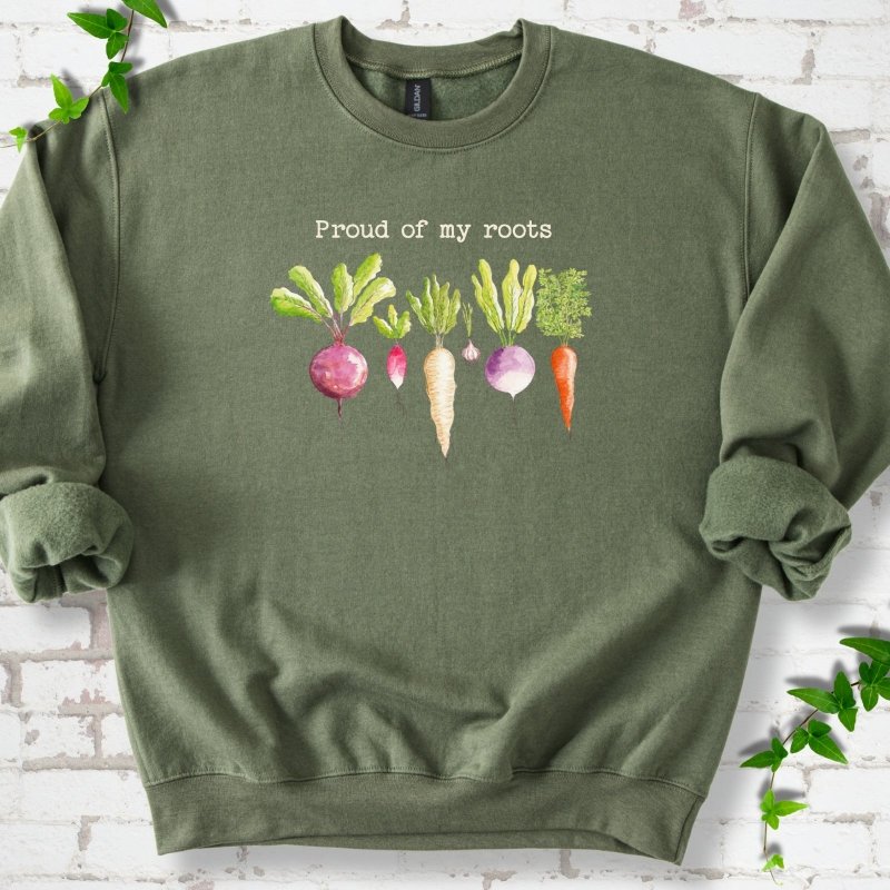 Military Green classic sweatshirt shown flat with "Proud of My Roots" text above watercolor-style root vegetables