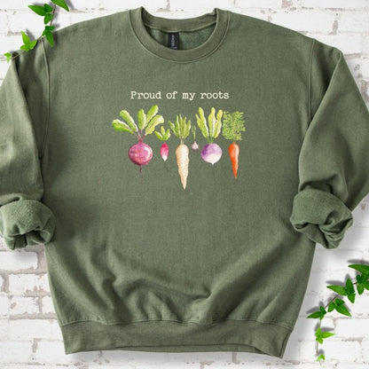 Military Green classic sweatshirt shown flat with "Proud of My Roots" text above watercolor-style root vegetables