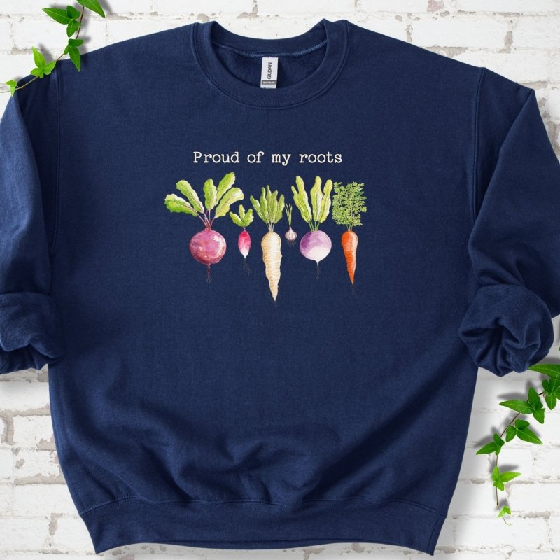 Navy classic sweatshirt shown flat with "Proud of My Roots" text above watercolor-style root vegetables