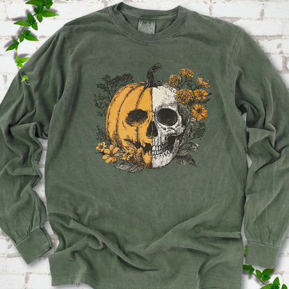 Hemp Comfort Colors® long sleeve T-shirt flat lay featuring a half-pumpkin, half-skull botanical Halloween graphic.