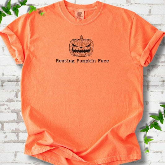 Resting Pumpkin Face funny Halloween T-shirt in Melon with jack-o'-lantern face graphic