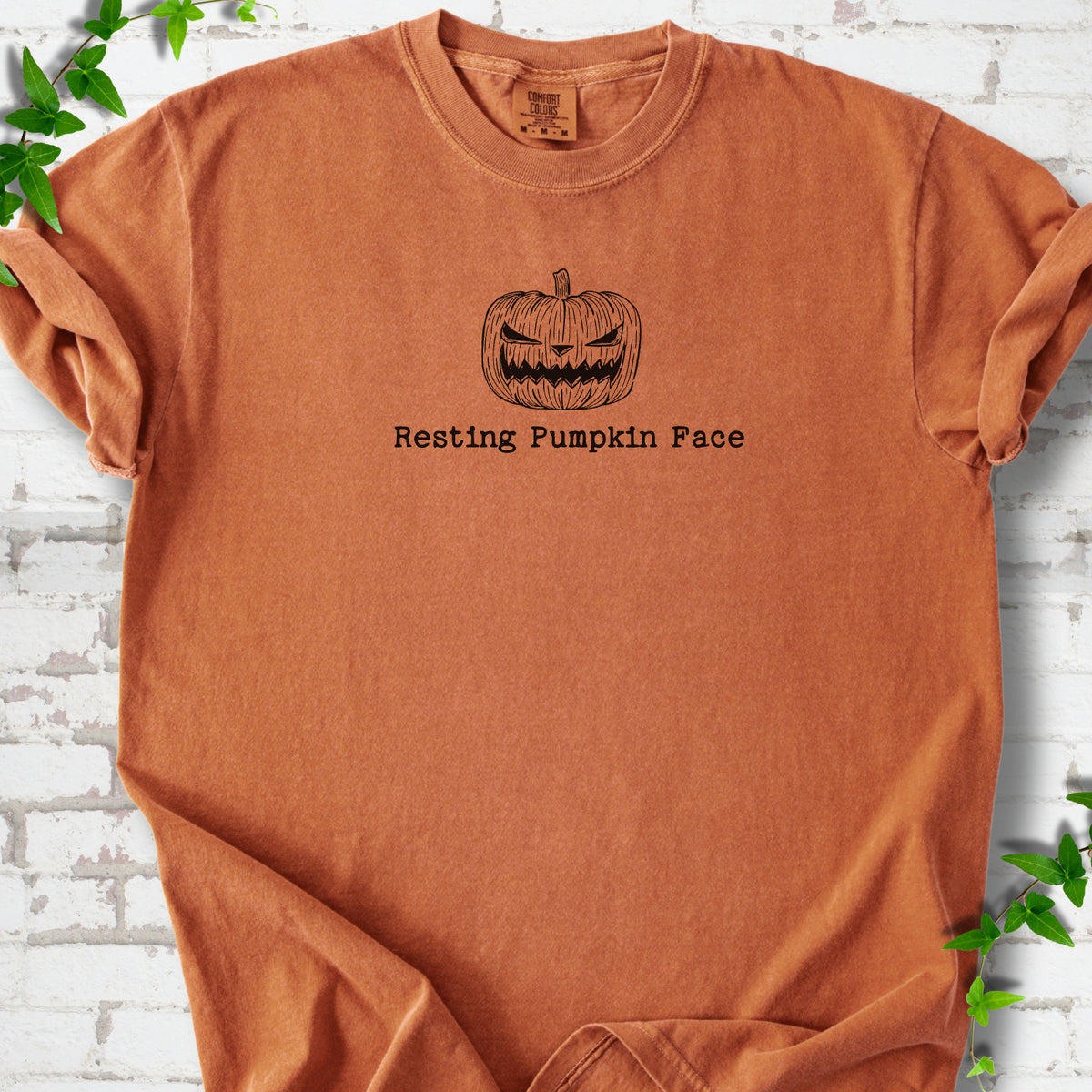 Resting Pumpkin Face funny Halloween T-shirt in Yam with jack-o'-lantern face graphic