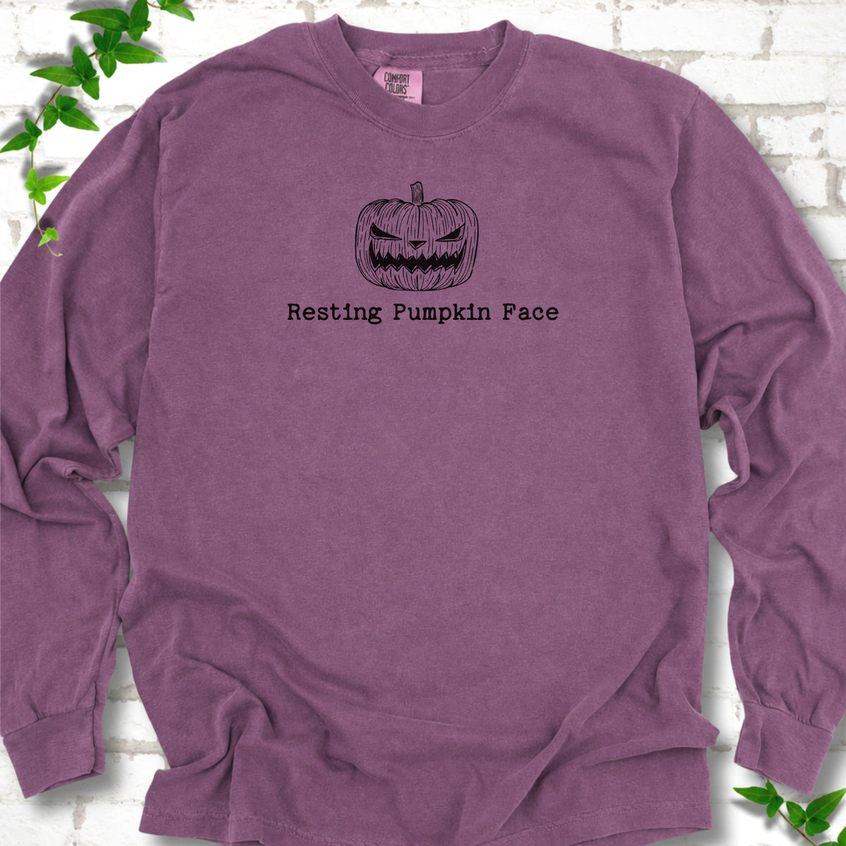 Resting Pumpkin Face funny Halloween long sleeve shirt in Berry with jack-o'-lantern face graphic