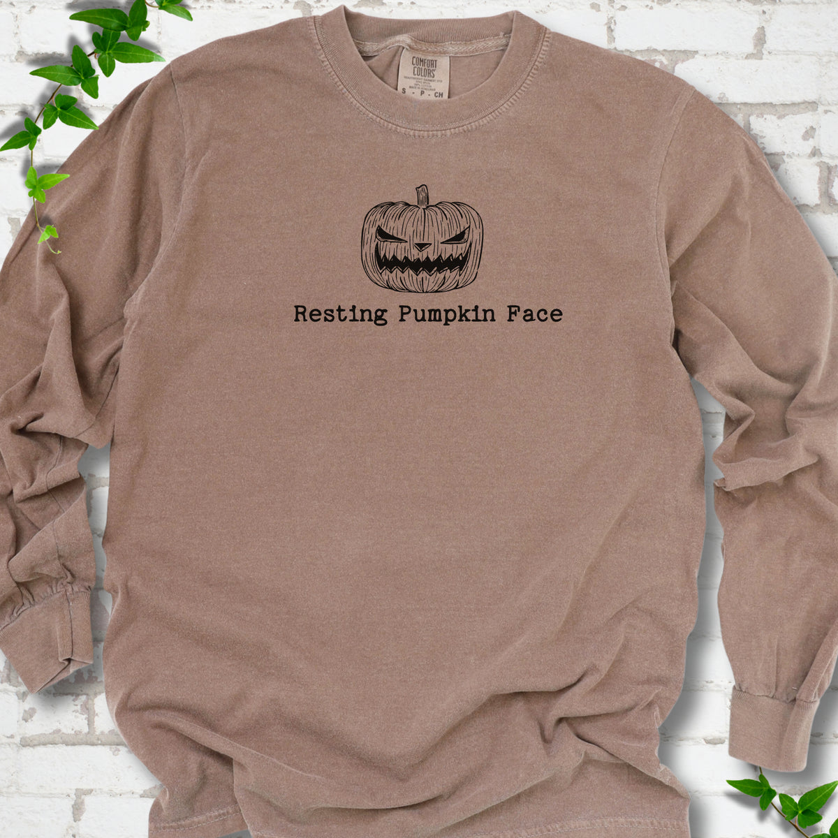 Resting Pumpkin Face funny Halloween long sleeve shirt in Espresso with jack-o'-lantern face graphic