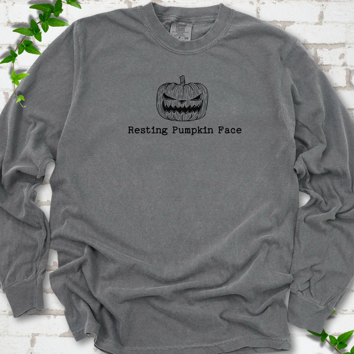 Resting Pumpkin Face funny Halloween long sleeve shirt in Pepper with jack-o'-lantern face graphic