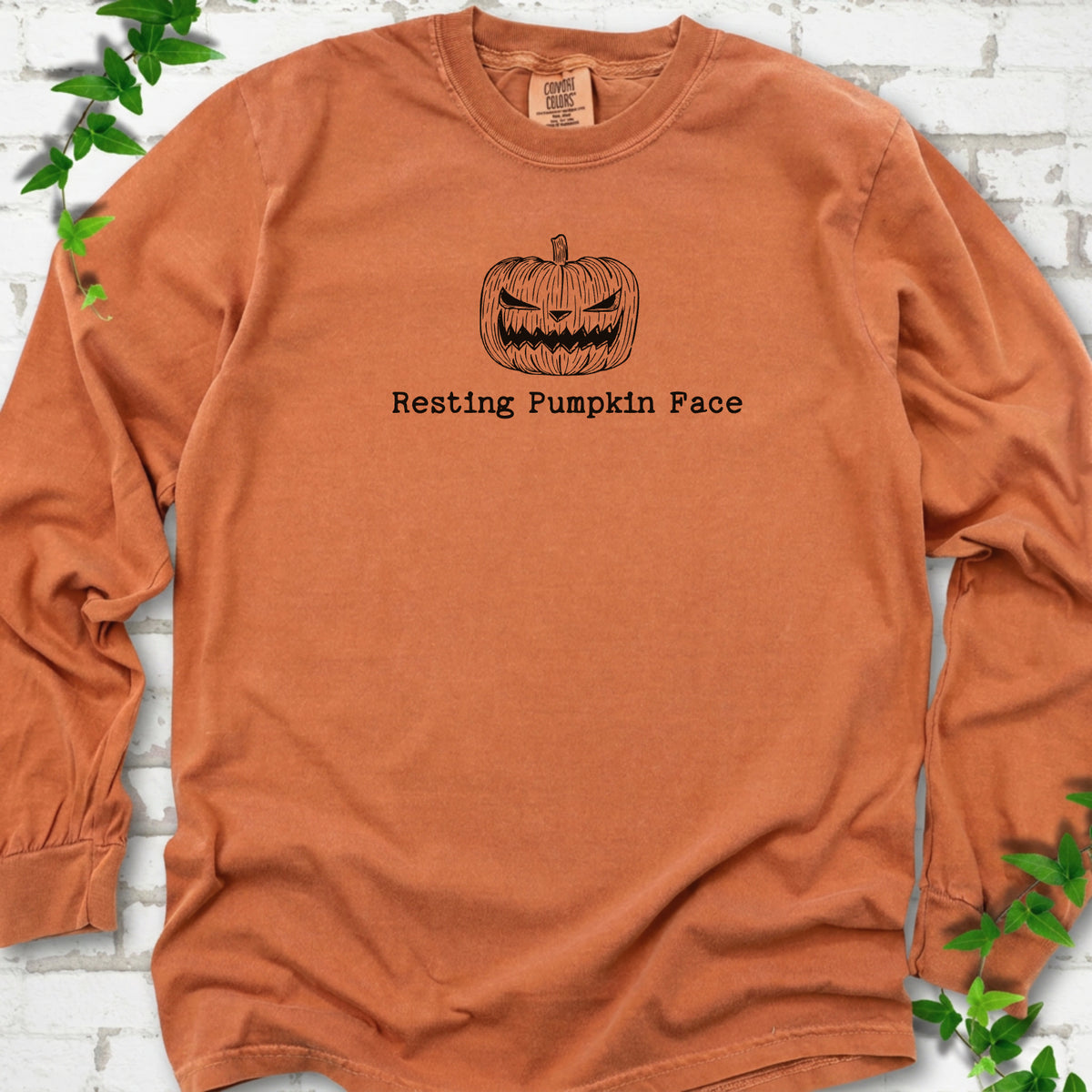 Resting Pumpkin Face funny Halloween long sleeve shirt in Yam with jack-o'-lantern face graphic