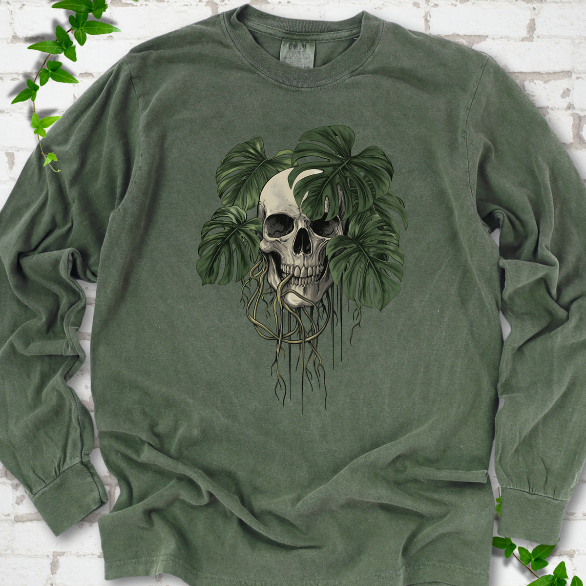 Hemp Comfort Colors T-shirt shown flat with the Root Bound Monstera skull and trailing roots graphic