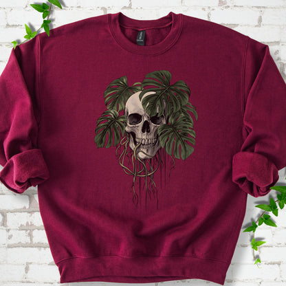 Maroon classic sweatshirt shown flat with the Root Bound Monstera skull and trailing roots graphic