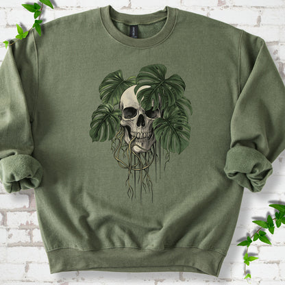 Military Green classic sweatshirt shown flat with the Root Bound Monstera skull and trailing roots graphic