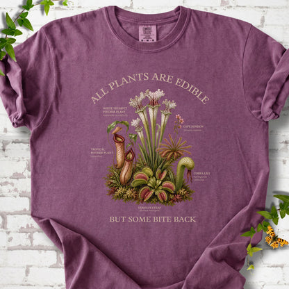 Berry Comfort Colors® T-shirt front mockup featuring a botanical illustration of various carnivorous plants including a Venus Flytrap, Pitcher Plants, Cape Sundew, and Cobra Lily.