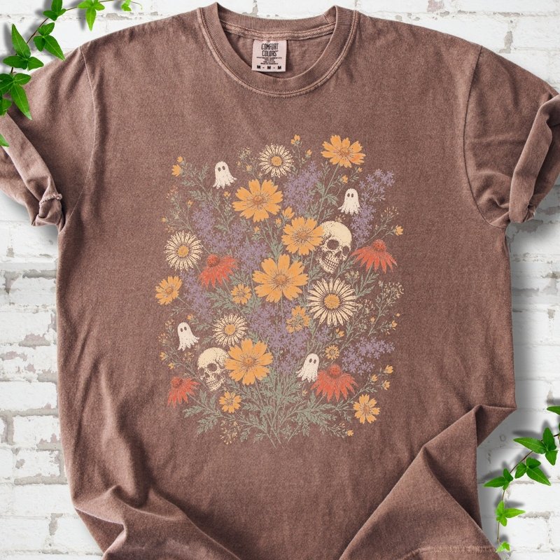 Espresso Comfort Colors® T-shirt flat lay featuring a colorful wildflower bouquet with tiny ghosts and skulls.