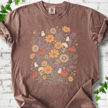 Espresso Comfort Colors® T-shirt flat lay featuring a colorful wildflower bouquet with tiny ghosts and skulls.