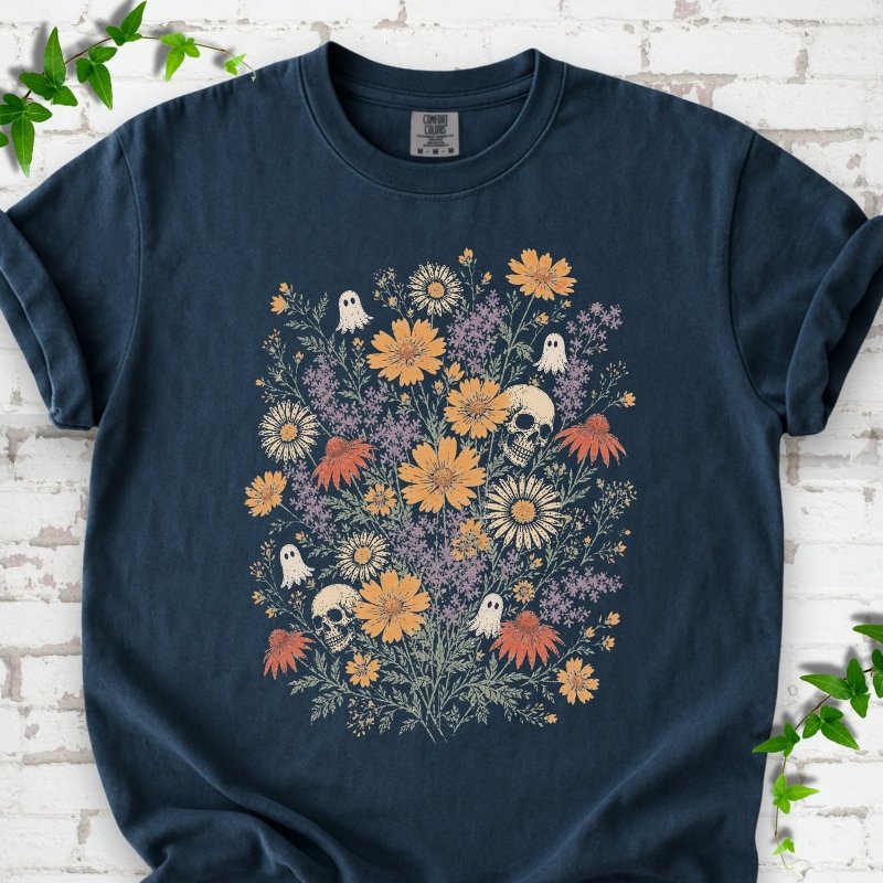 Midnight Comfort Colors® T-shirt flat lay featuring a colorful wildflower bouquet with tiny ghosts and skulls.