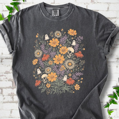 Pepper Comfort Colors® T-shirt flat lay featuring a colorful wildflower bouquet with tiny ghosts and skulls.