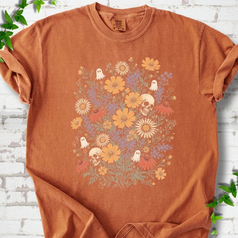 Yam Comfort Colors® T-shirt flat lay featuring a colorful wildflower bouquet with tiny ghosts and skulls.