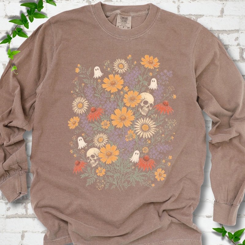 Espresso Comfort Colors® long sleeve T-shirt flat lay featuring a colorful wildflower bouquet with tiny ghosts and skulls.