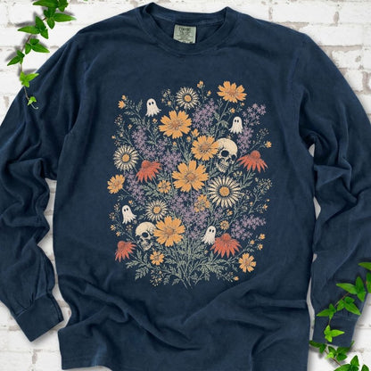Midnight Comfort Colors® long sleeve T-shirt flat lay featuring a colorful wildflower bouquet with tiny ghosts and skulls.