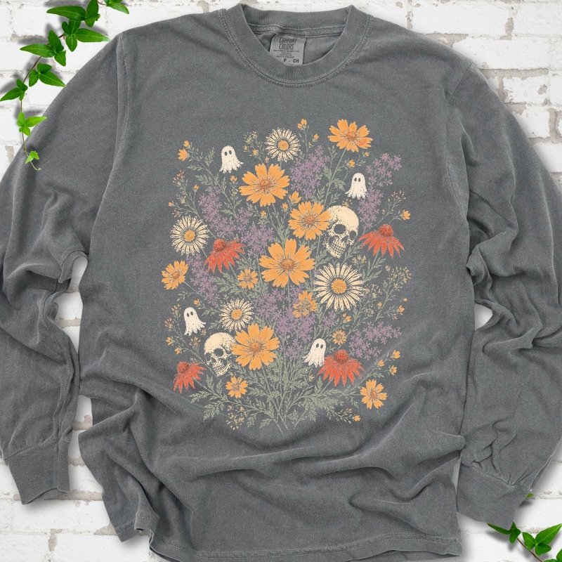 Pepper Comfort Colors® long sleeve T-shirt flat lay featuring a colorful wildflower bouquet with tiny ghosts and skulls.