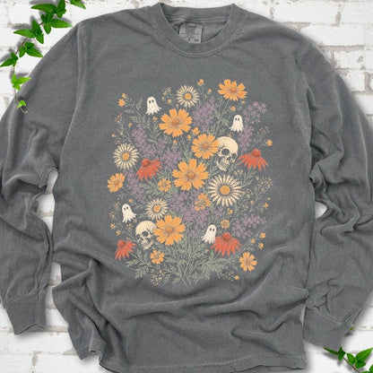 Pepper Comfort Colors® long sleeve T-shirt flat lay featuring a colorful wildflower bouquet with tiny ghosts and skulls.