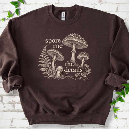 Dark Chocolate brown crewneck sweatshirt with "spore me the details" and engraved toadstools, fern and clover in cream ink