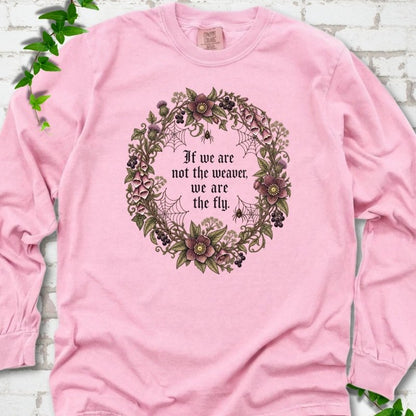 Blossom long sleeve T-shirt flat-lay mockup with a gothic floral wreath, spider webs and "If we are not the weaver, we are the fly" lettering.