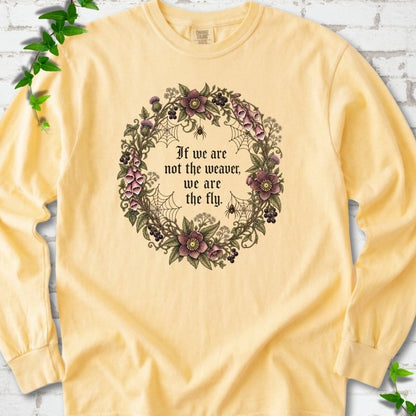 Butter long sleeve T-shirt flat-lay mockup with a gothic floral wreath, spider webs and "If we are not the weaver, we are the fly" lettering.
