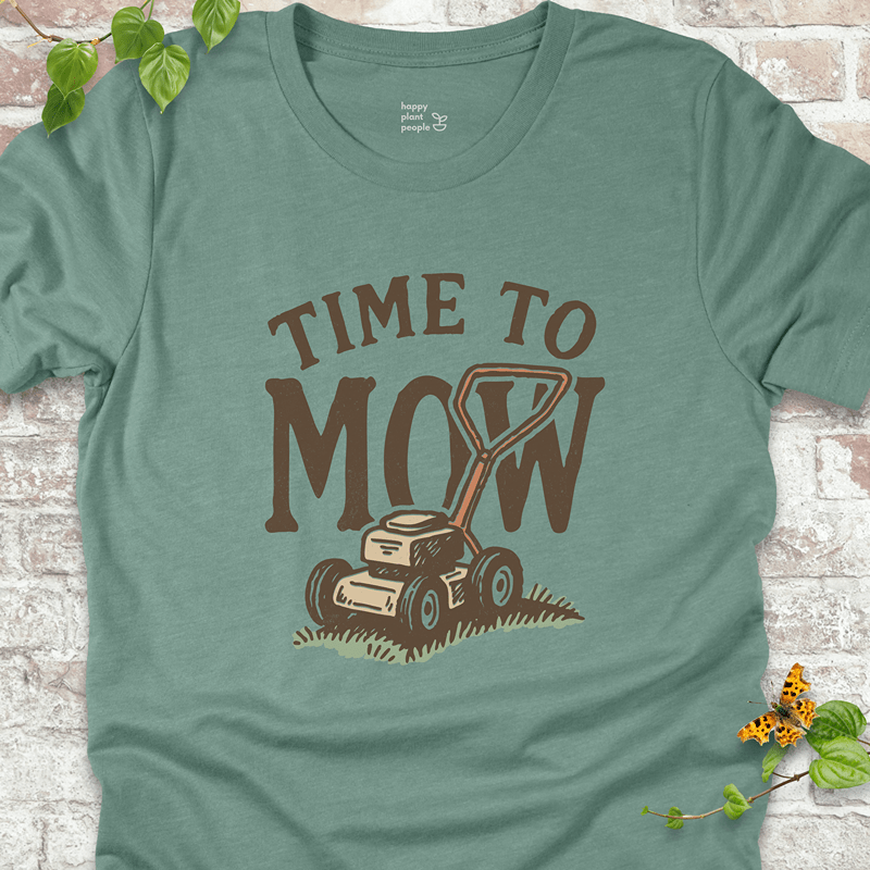 Bella+Canvas unisex T-shirt in Heather Dusty Blue with illustrated mower graphic. Soft and breathable tee for lawn-obsessed folks.