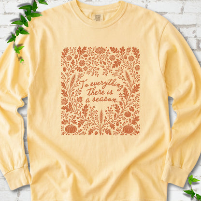 Butter Comfort Colors® long sleeve T-shirt flat lay with botanical To Everything There Is a Season Bible verse artwork.