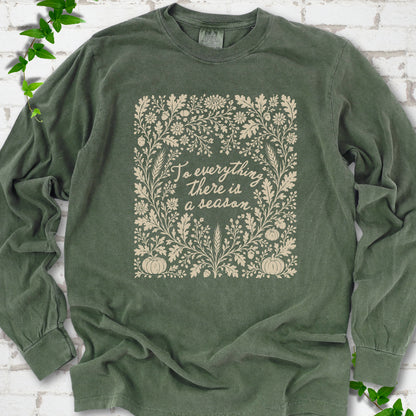Hemp Comfort Colors® long sleeve T-shirt flat lay with botanical To Everything There Is a Season Bible verse artwork.