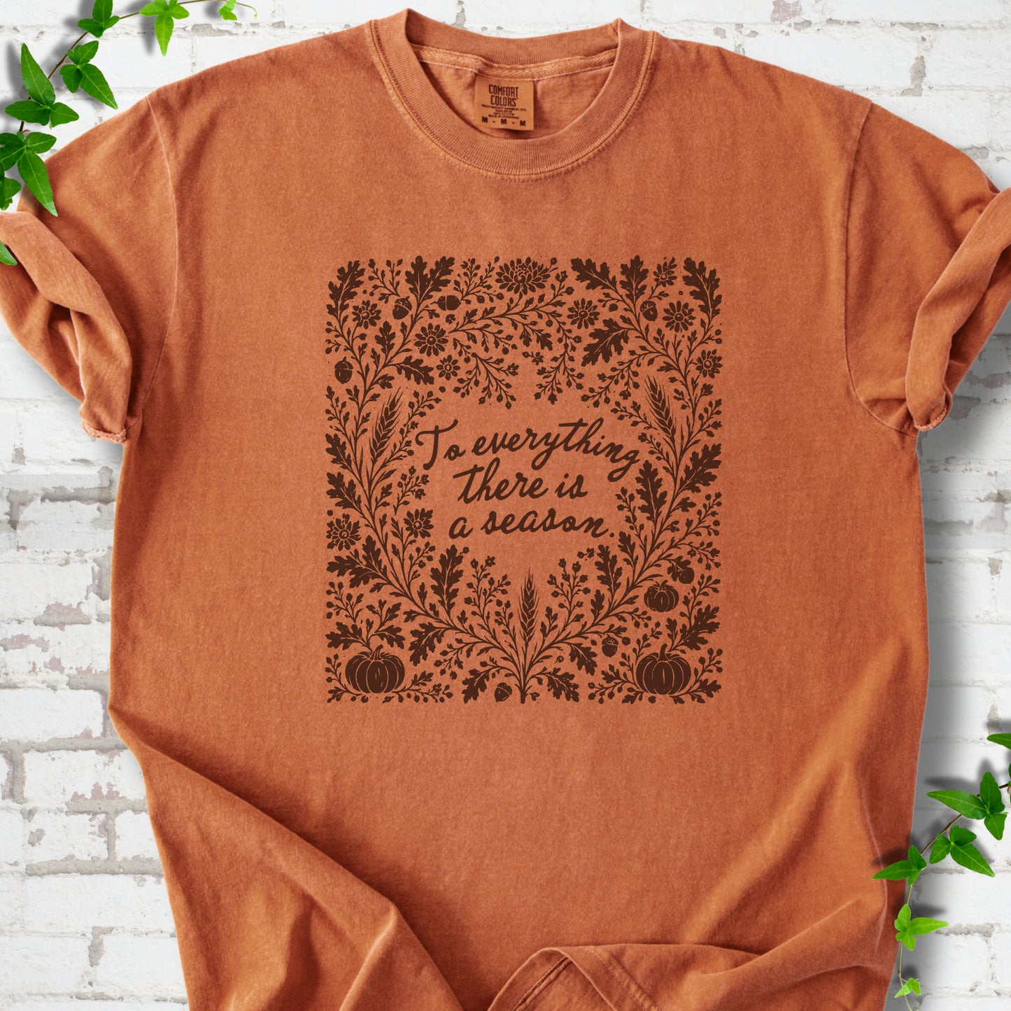 Yam Comfort Colors® T-shirt flat lay with botanical To Everything There Is a Season Bible verse artwork.