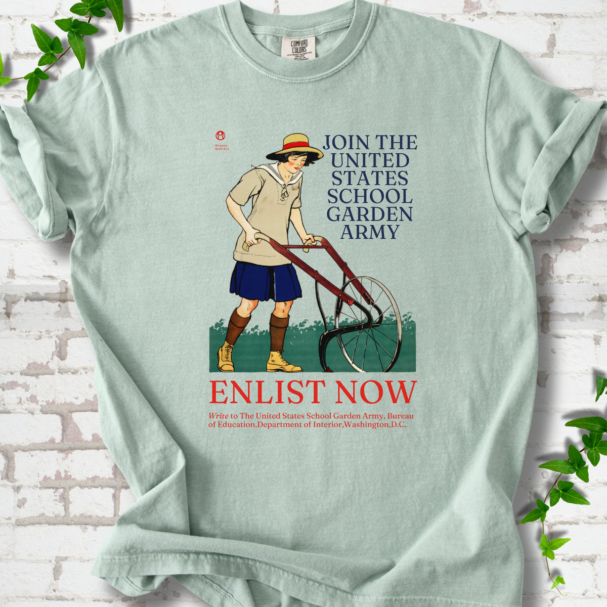 Bay Comfort Colors® T-shirt featuring Edward Penfield’s 1918 School Garden Army poster with a young gardener, wheel hoe and “Enlist Now” text.