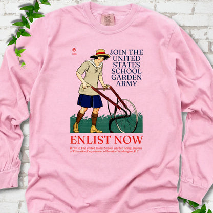Blossom Comfort Colors® long sleeve shirt featuring Edward Penfield’s 1918 School Garden Army poster with a young gardener, wheel hoe and “Enlist Now” text.