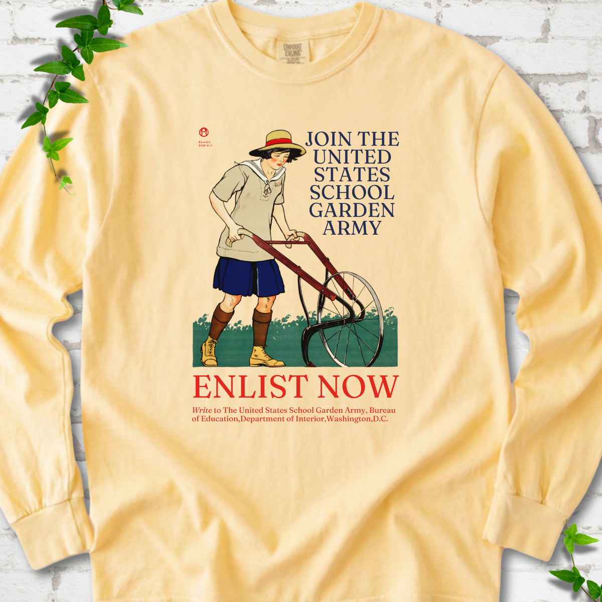 Butter Comfort Colors® long sleeve shirt featuring Edward Penfield’s 1918 School Garden Army poster with a young gardener, wheel hoe and “Enlist Now” text.
