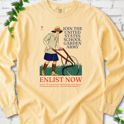 Butter Comfort Colors® long sleeve shirt featuring Edward Penfield’s 1918 School Garden Army poster with a young gardener, wheel hoe and “Enlist Now” text.