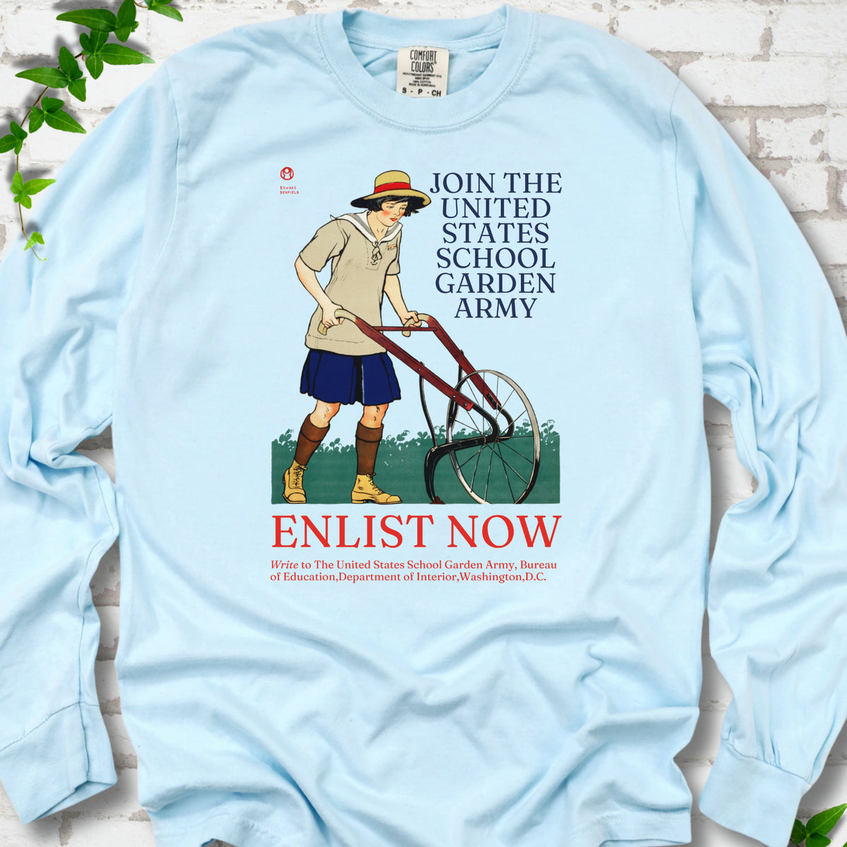 Chambray Comfort Colors® long sleeve shirt featuring Edward Penfield’s 1918 School Garden Army poster with a young gardener, wheel hoe and “Enlist Now” text.