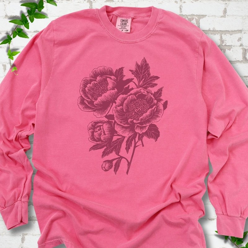 Crunchberry Comfort Colors® long sleeve T-shirt flat lay featuring vintage-style peony line art.