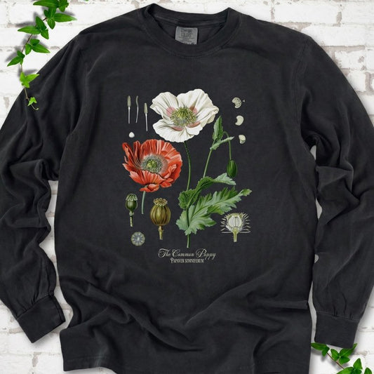 Black Comfort Colors® long sleeve T-shirt flat lay featuring vintage botanical poppy studies from bud to seed head.