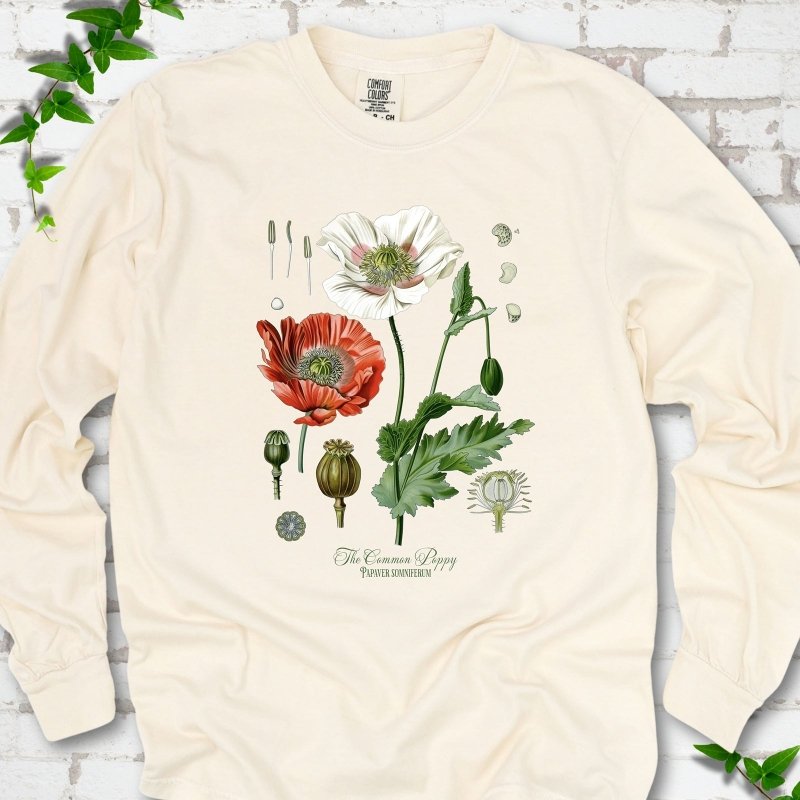 Ivory Comfort Colors® long sleeve T-shirt flat lay featuring vintage botanical poppy studies from bud to seed head.