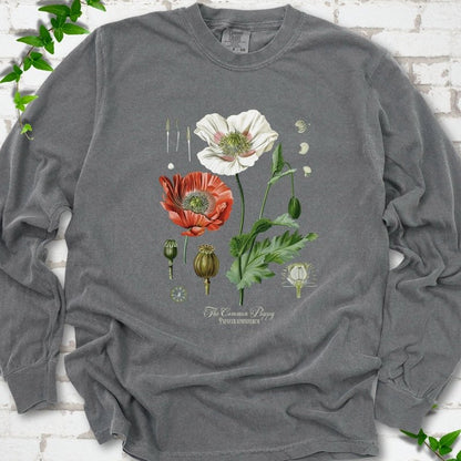 Pepper Comfort Colors® long sleeve T-shirt flat lay featuring vintage botanical poppy studies from bud to seed head.