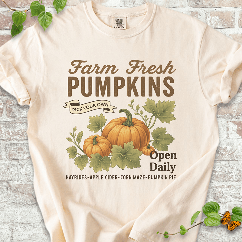 Vintage Pumpkin T-shirt on Comfort Colors™ Ivory – features a soft autumn design with bold "Farm Fresh Pumpkins" lettering and hand-drawn pumpkins surrounded by leafy vines