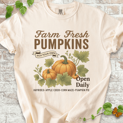 Vintage Pumpkin T-shirt on Comfort Colors™ Ivory – features a soft autumn design with bold "Farm Fresh Pumpkins" lettering and hand-drawn pumpkins surrounded by leafy vines