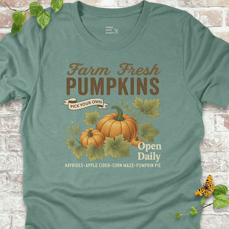 Lightweight vintage-style pumpkin tee on a muted blue shirt, ideal for cozy fall layering