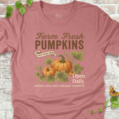 Pumpkin-themed lightweight tee on a soft pink-mauve shirt, perfect for garden girls and fall lovers