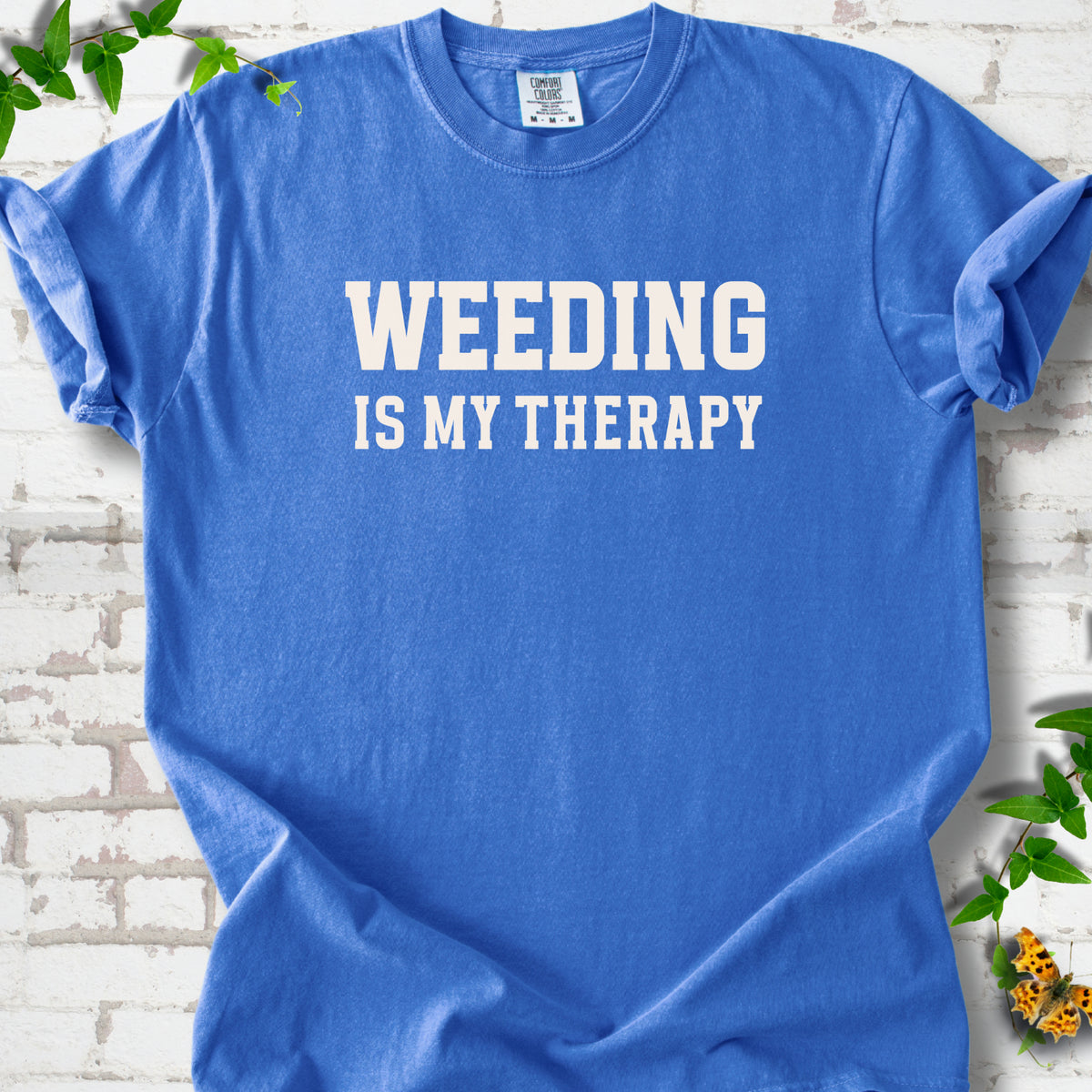 Flo Blue Comfort Colors® T-shirt with Weeding Is My Therapy text design.
