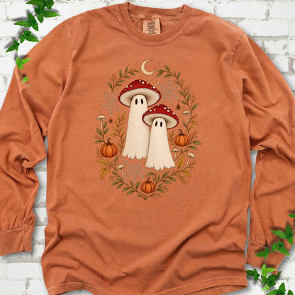 Yam Comfort Colors® long sleeve T-shirt laid flat, showing two cream ghosts wearing red mushroom caps, surrounded by small pumpkins, autumn leaves and a crescent moon.